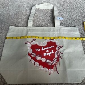 “No Human is Illegal” Canvas Shopping Bag with Red Graphic Size 15x20 NWT
